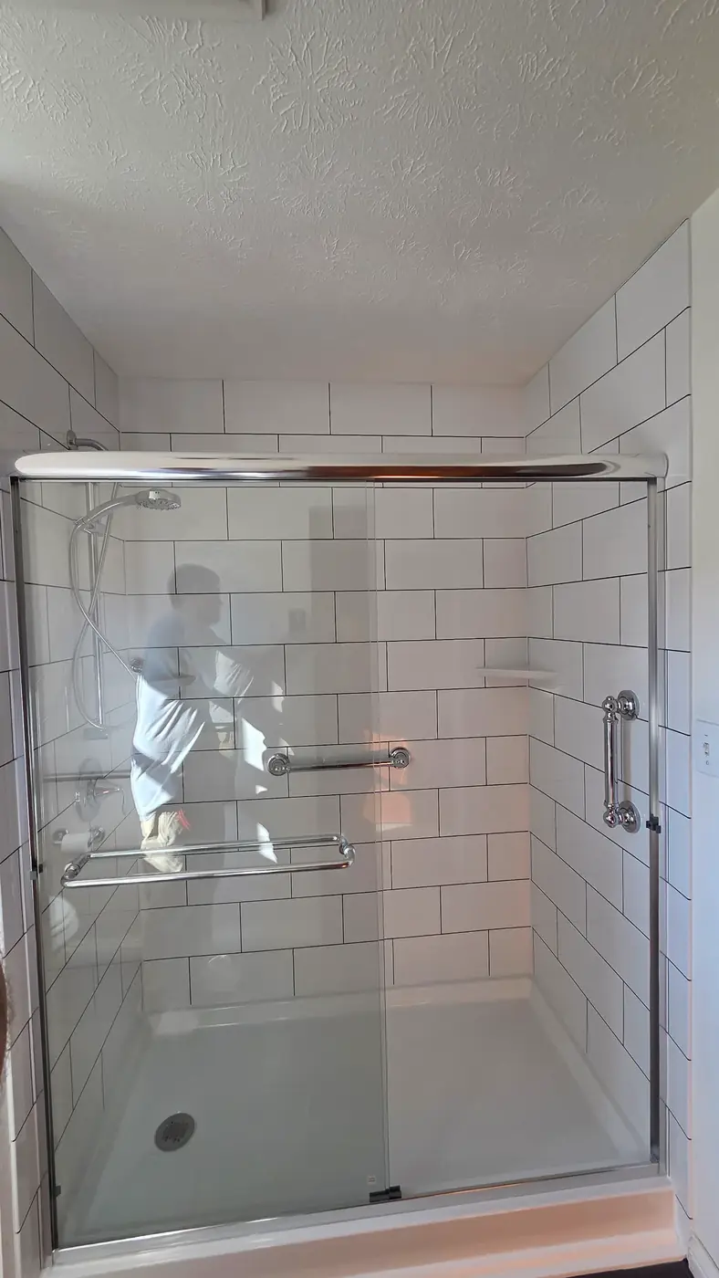 Glass sliding door shower with white subway tile and low-threshold pan in Mason, OH