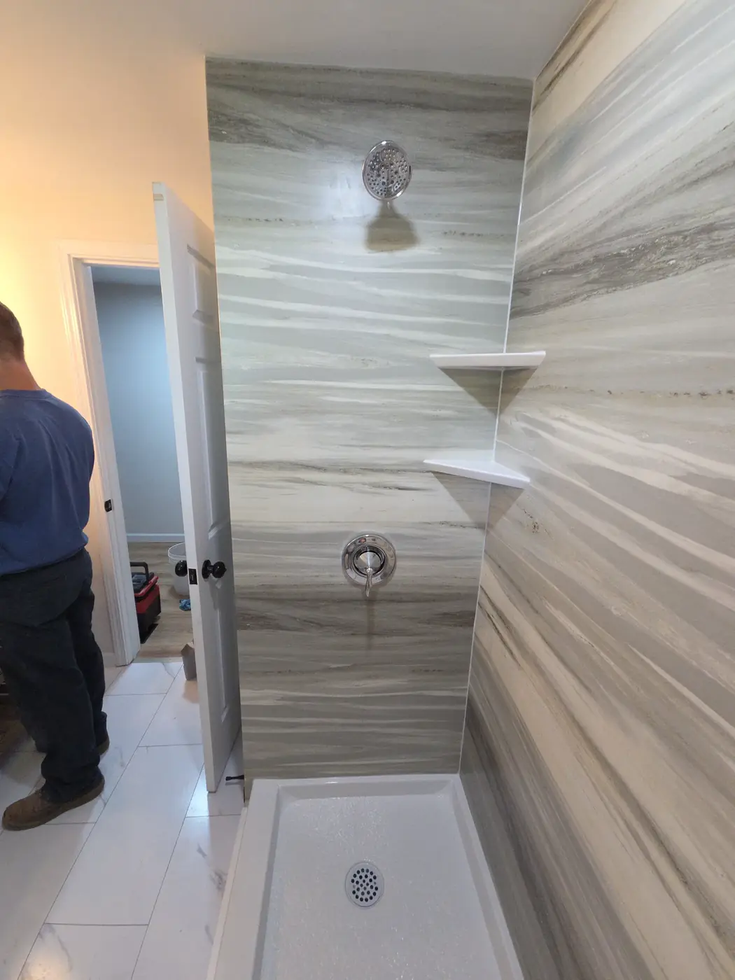 Gray-veined shower surround with built-in corner shelves and white pan in Mason, OH