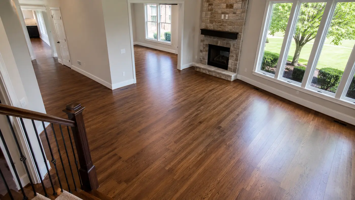 Refinished hardwood floors in a living room seen from the staircase in Mason, OH